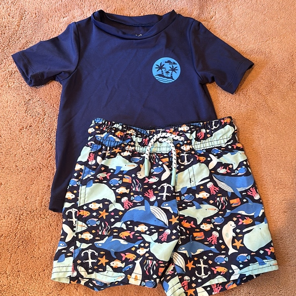 Cat and Jack rashguard and swim trunks. Sold as a set.